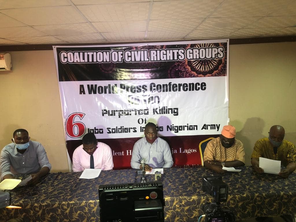 Five men seated at a table for a world press conference beneath a Coalition of Civil Rights Groups banner on the purported killing of six Igbo soldiers in the Nigerian Army.